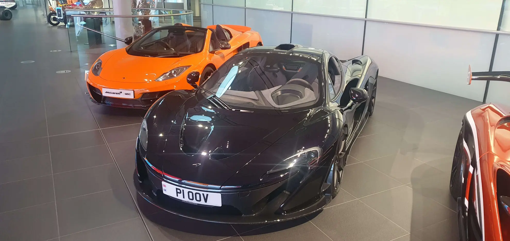 P1 next to an MP4-12C